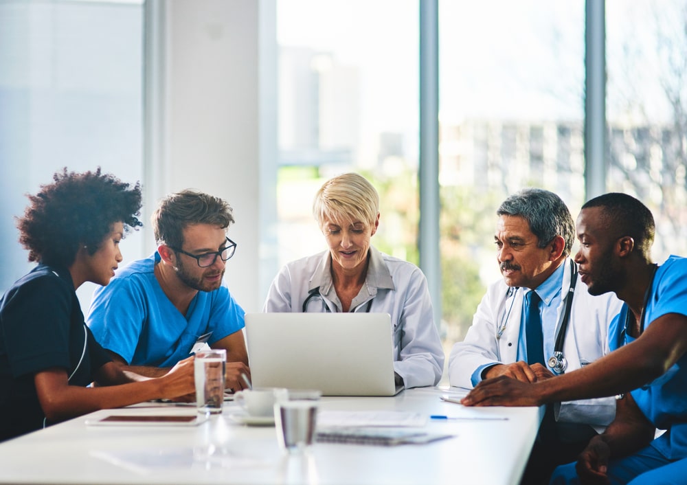 An image showing a group of mental health professionals discussing multilingual mental health